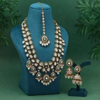 Pristine pearl white color kundan necklace set crafted for traditional wedding wear 1