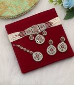 Soft light pink color choker kundan necklace set styled for minimalist elegance