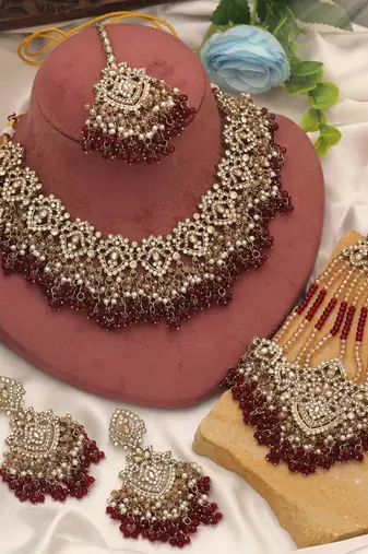Rich velvet maroon color kundan necklace set designed for traditional indian outfits