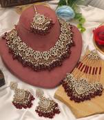 Rich velvet maroon color kundan necklace set designed for traditional indian outfits