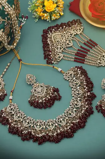 Rich velvet maroon color kundan necklace set designed for traditional indian outfits