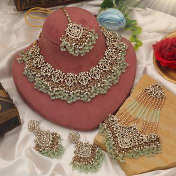 Pastel pista green color kundan necklace set tailored for daytime sangeet functions 1