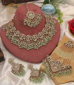 Pastel pista green color kundan necklace set tailored for daytime sangeet functions