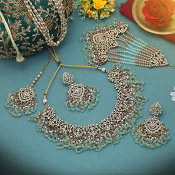 Pastel pista green color kundan necklace set tailored for daytime sangeet functions 2