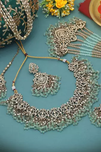 Pastel pista green color kundan necklace set tailored for daytime sangeet functions