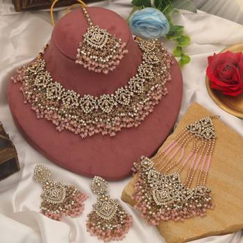 Charming baby light pink color kundan necklace set created for festive celebrations 1