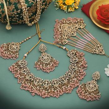 Charming baby light pink color kundan necklace set created for festive celebrations 2