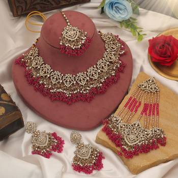 Vivid royal rani color kundan necklace set styled for traditional bridal attire 1