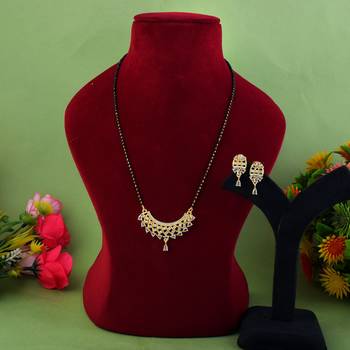 Lustrous sheen gold color american diamond mangalsutra crafted for wedding wear 1