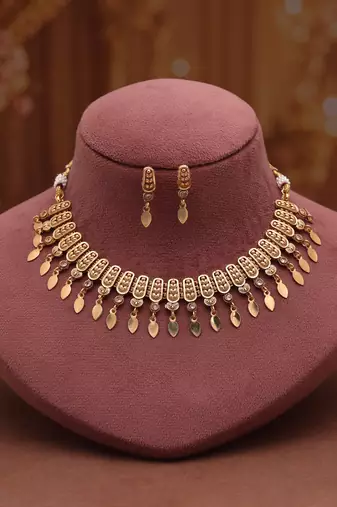 Graceful pearl white color matte gold necklace set featuring sleek drop earrings