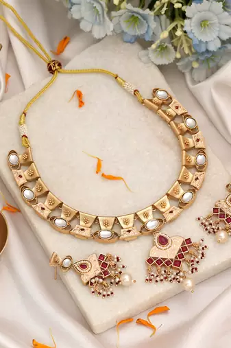Soft blush pink color matte gold necklace set accompanied by dangle earrings