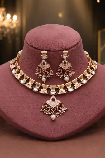 Soft blush pink color matte gold necklace set accompanied by dangle earrings