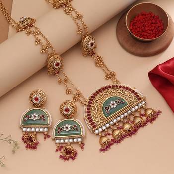 Vibrant rani color matte gold necklace set paired with dangle earrings 1
