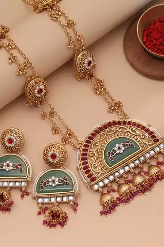 Vibrant rani color matte gold necklace set paired with dangle earrings
