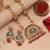 Vibrant rani color matte gold necklace set paired with dangle earrings