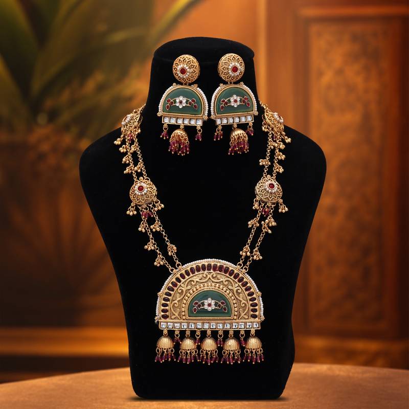 Vibrant rani color matte gold necklace set paired with dangle earrings