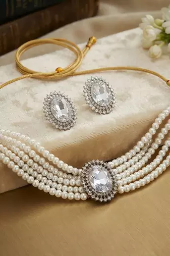 Pristine diamond white color stone necklace set styled for formal evening parties