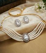 Pristine diamond white color stone necklace set styled for formal evening parties