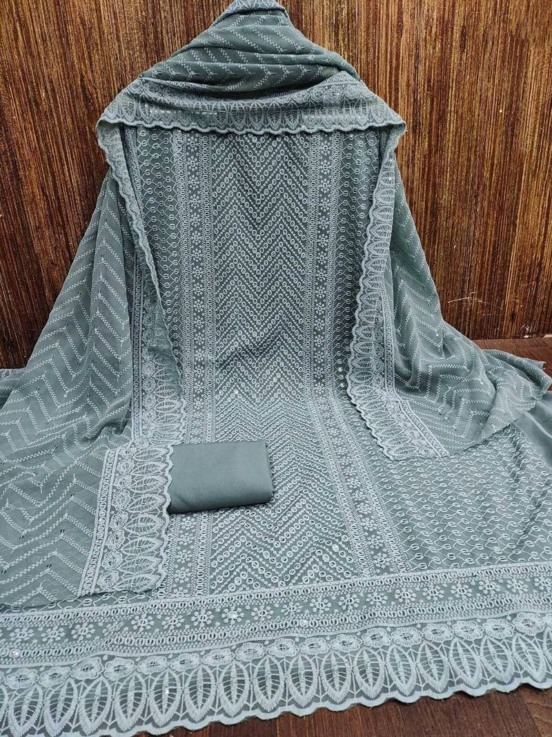 ethnic motifs embroidered sequinned unstitched dress material