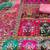 women pink printed geometric dress material