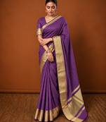 Women's wine & golden zari woven kanjivaram style silk blend saree with blouse piece