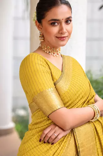 Women's yellow & golden zari woven kanjivaram style silk blend saree with blouse piece