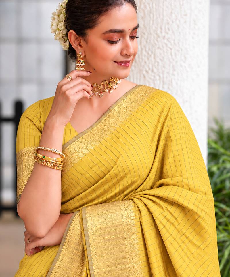 Women's yellow & golden zari woven kanjivaram style silk blend saree with blouse piece
