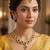 Glorious flower and circle design green stone gold plated choker necklace set with maang tikka for women and girls
