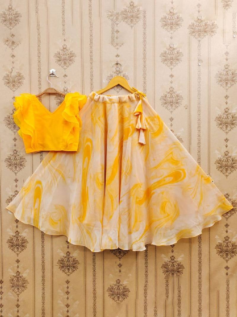 Girls yellow tie and dye printed v neck georgette blouse & lehenga