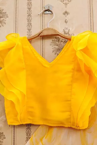 Girls yellow tie and dye printed v neck georgette blouse & lehenga
