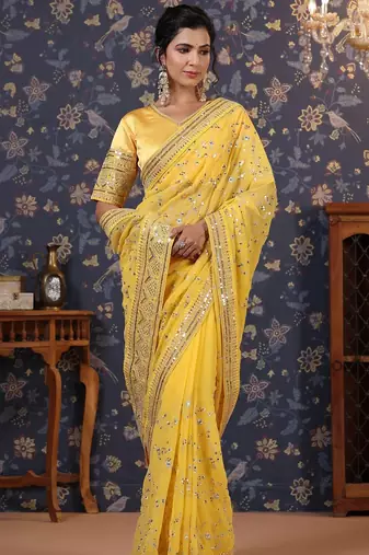 Yellow sequinned embellished saree with blouse piece