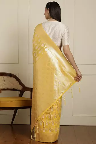 Yellow ethnic motifs woven design muga saree with unstitched blouse