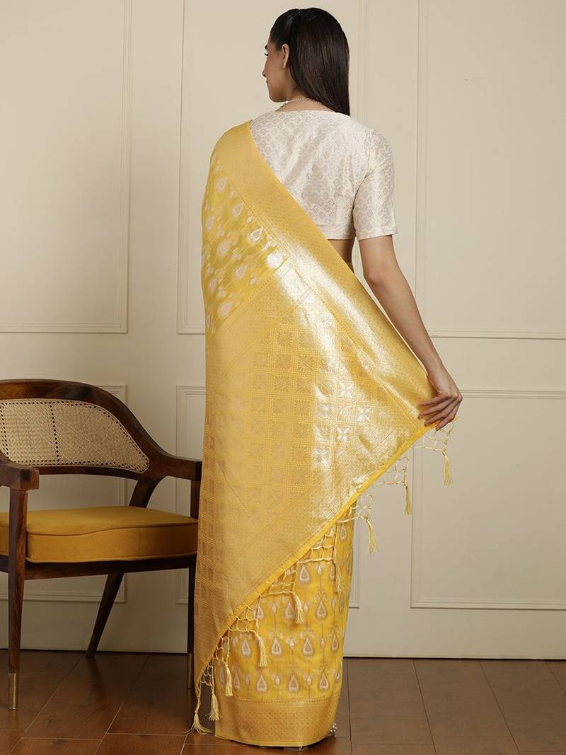 Yellow ethnic motifs woven design muga saree with unstitched blouse