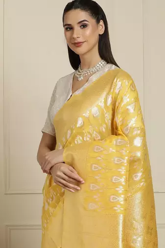 Yellow ethnic motifs woven design muga saree with unstitched blouse