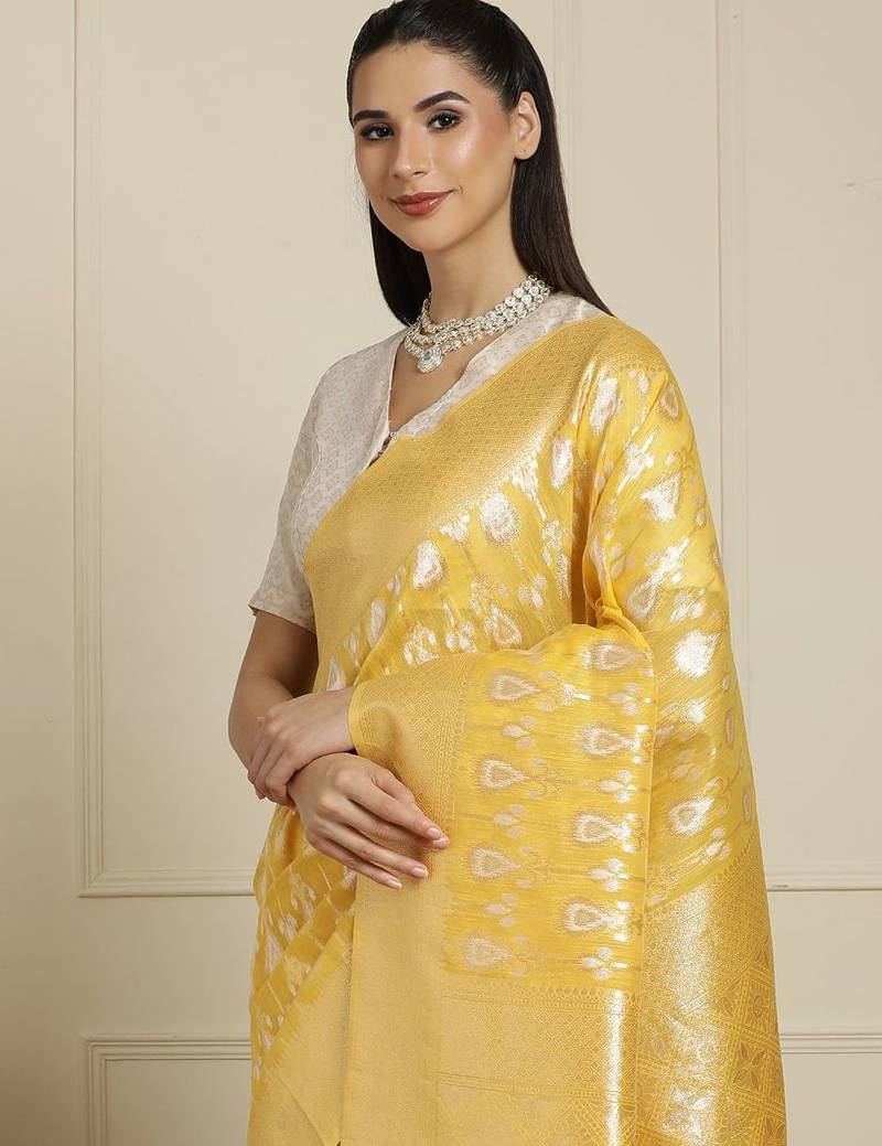 Yellow ethnic motifs woven design muga saree with unstitched blouse