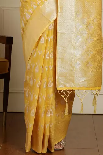Yellow ethnic motifs woven design muga saree with unstitched blouse