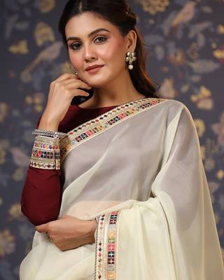Cream sequinned embellished saree 1