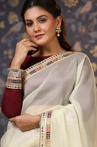 Cream sequinned embellished saree