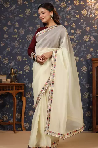 Cream sequinned embellished saree