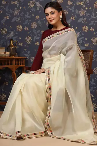 Cream sequinned embellished saree