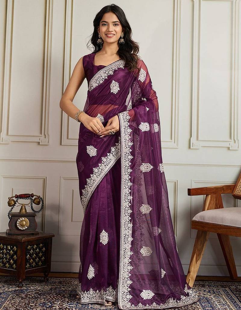 Magenta ethnic motifs embroidered net saree