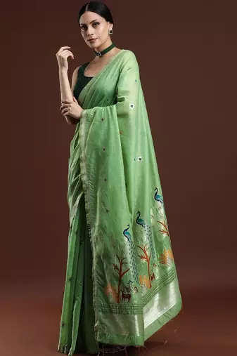Green woven design muga saree with blouse