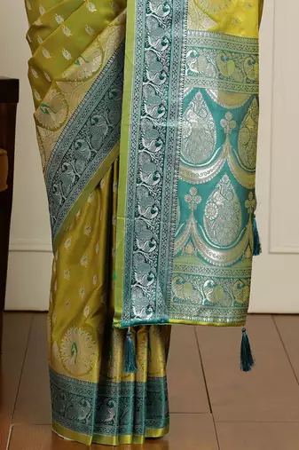 Green woven design banarasi saree with unstitched blouse