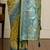 Green woven design banarasi saree with unstitched blouse