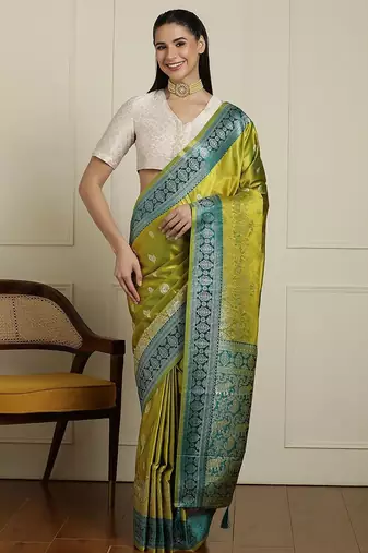 Green woven design banarasi saree with blouse piece