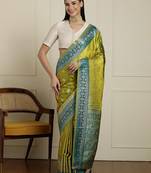 Green woven design banarasi saree with blouse piece