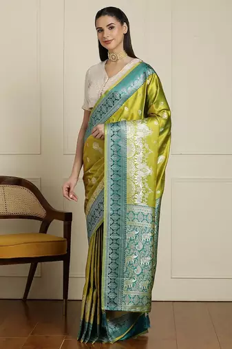 Green woven design banarasi saree with blouse piece