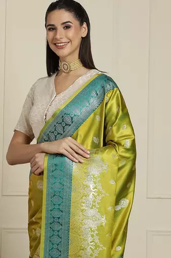 Green woven design banarasi saree with blouse piece
