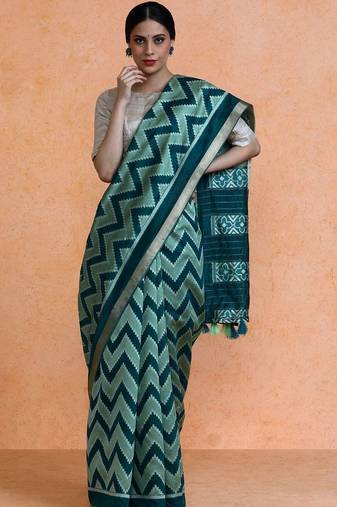 Green woven design saree with blouse
