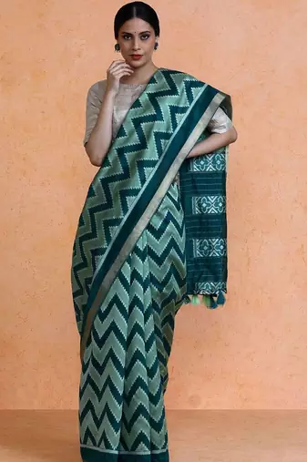 Green woven design saree with blouse
